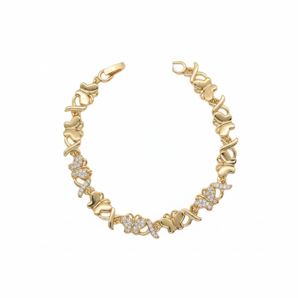 A gold plated link bracelet featuring alternating solid gold butterfly links and butterfly-shaped links paved with small clear stones, displayed on a clean white background.