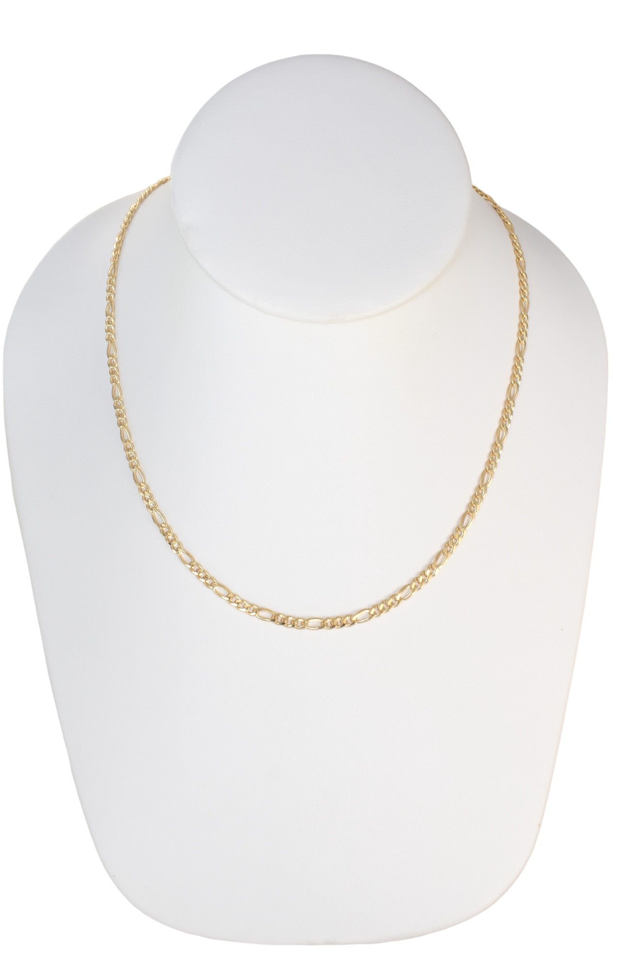 Gold Plated 100mm width Figaro Chain Necklace displayed on a jewelry display, available in 18", 20", 22", and 24" lengths.