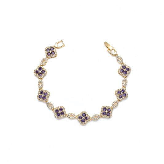 A gold plated bracelet featuring seven floral clusters of purple round gemstones surrounded by small clear stones, displayed on a clean white background.