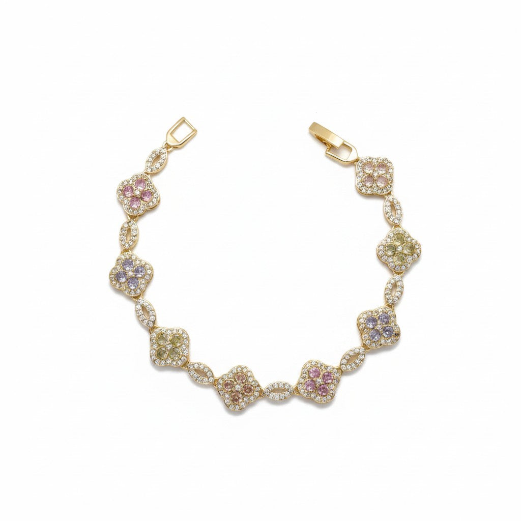 A gold plated bracelet featuring multiple pavé-set floral clusters in pastel tones, displayed on a clean white background.